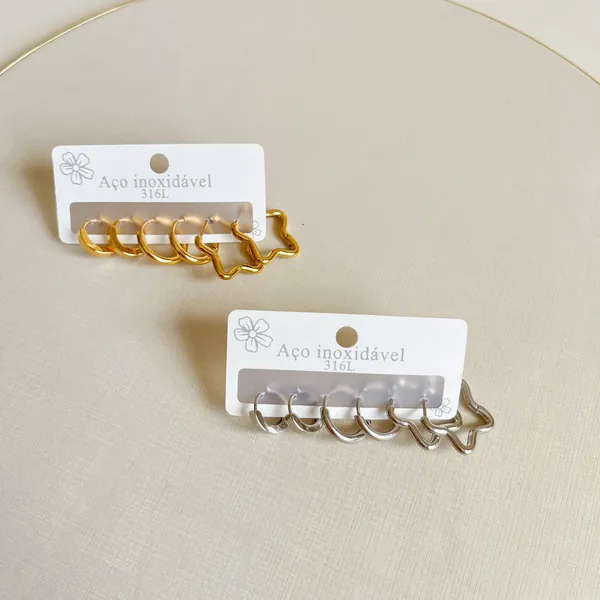 Modelo usando brincos dourados da DB Acessórios